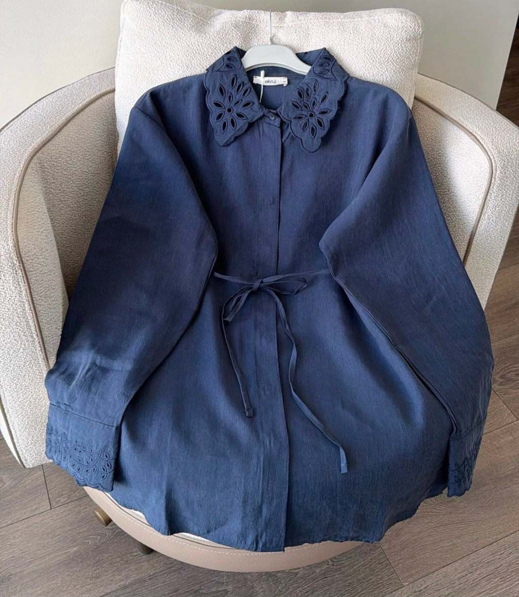 navy blue shirt with embroidered collar and cuff details